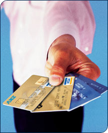 Hand holding ANZ Cards