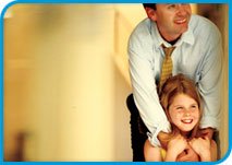 Father holding daughter