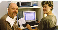 Father and son using a computer