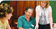 Staff discussing the MoneyMinded training sessions