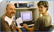 Father and son using a computer