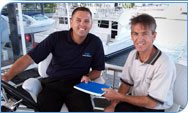 Two ANZ employees on a boat