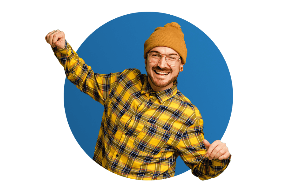 Man in a yellow shirt and beanie dancing